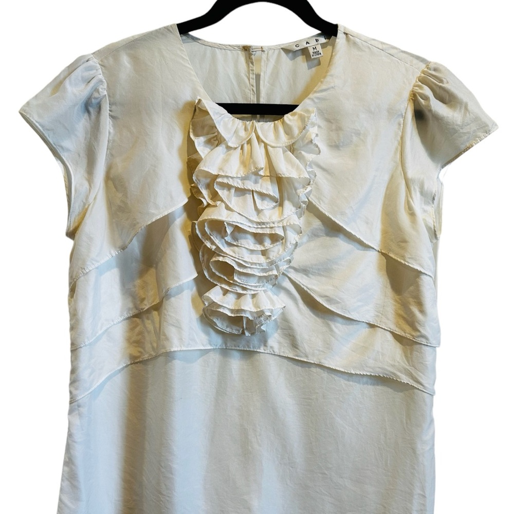 CAbi ivory silk ruffle with cap sleeve.